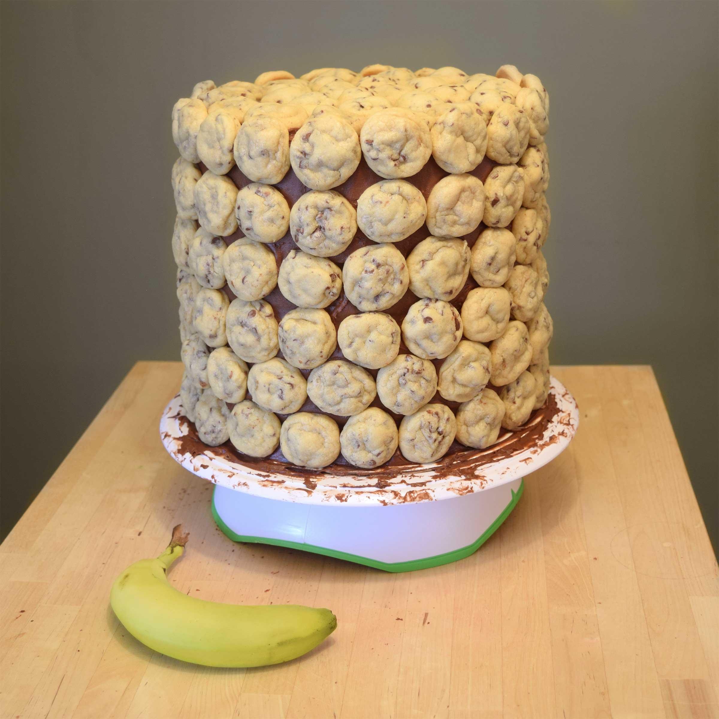 Completed cookie cake, shown with a banana for scale