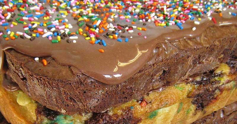 Close-up of the top of brownies covered with Nutella and sprinkles.