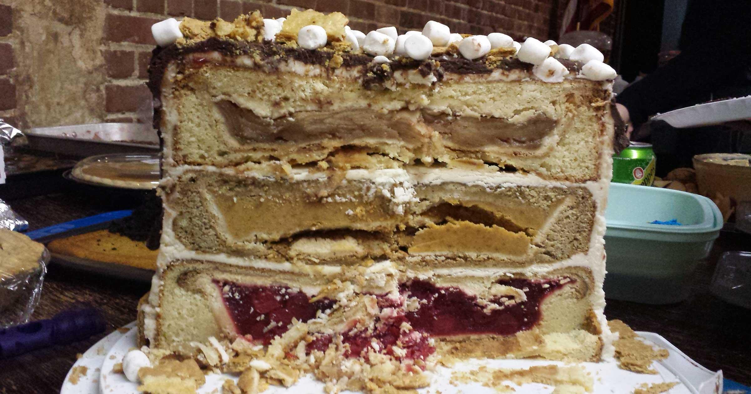 Cross-section of cake: 3 layers of different cake flavors, each with a different flavor pie in it.